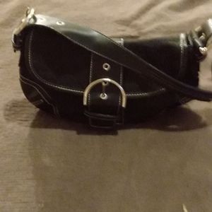 Step out in style with this shoulder bag from Coach.